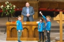 Rev Fergus Cook is assisted by some Beavers