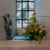 St Columba and a window flower arrangement