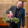 Rev Fergus Cook lights the 4th Advent candle