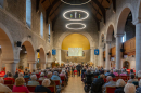 A large audience enjoy a concert of a variety of musical pieces