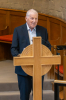 Eddie Thorn reads the intimations and welcomes Rev Dr Iain May