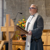 Rev Angus Mathieson reads the lesson from the Bible